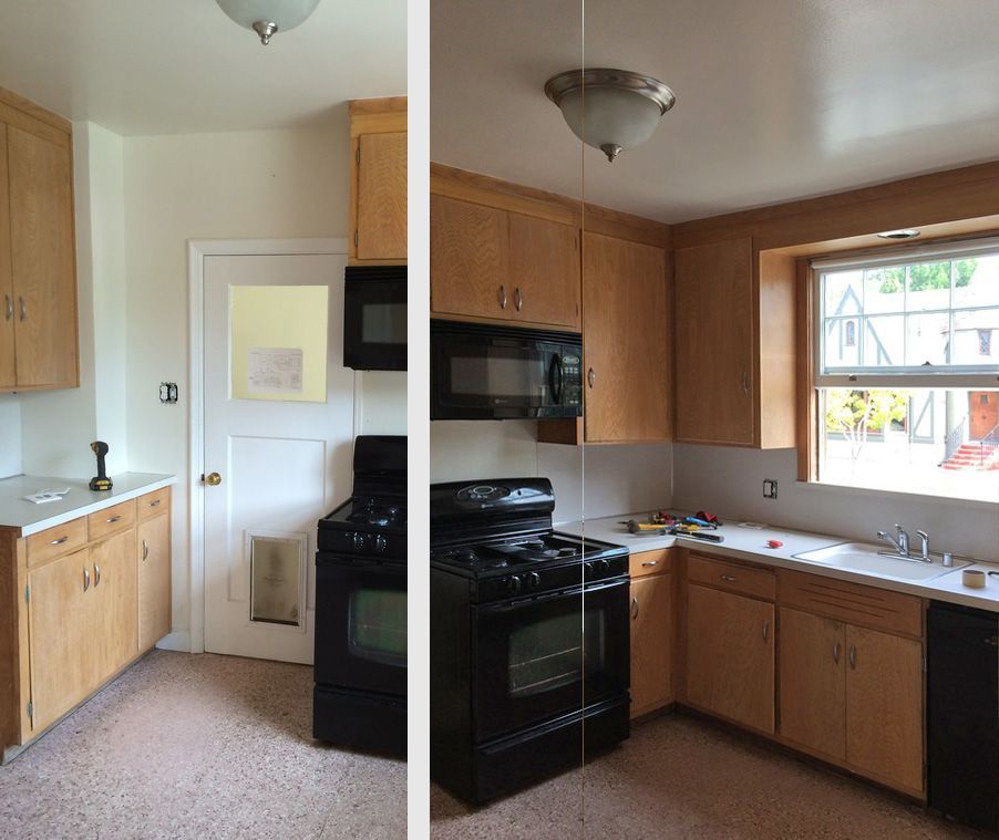 A kitchen with wooden cabinets and a black stove