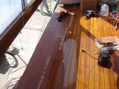 A wooden deck with a few tools on it