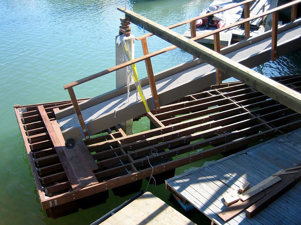 A wooden dock with stairs leading to the water