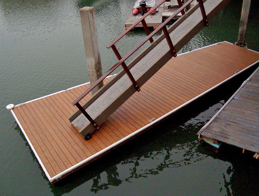 A wooden dock with stairs going up into the water