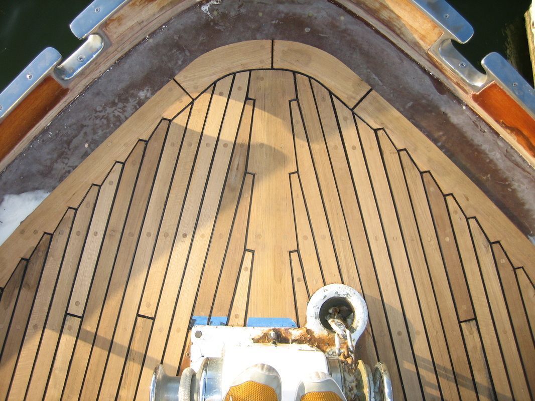 A close up of a wooden deck on a boat