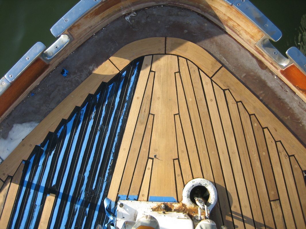 A close up of a wooden deck on a boat