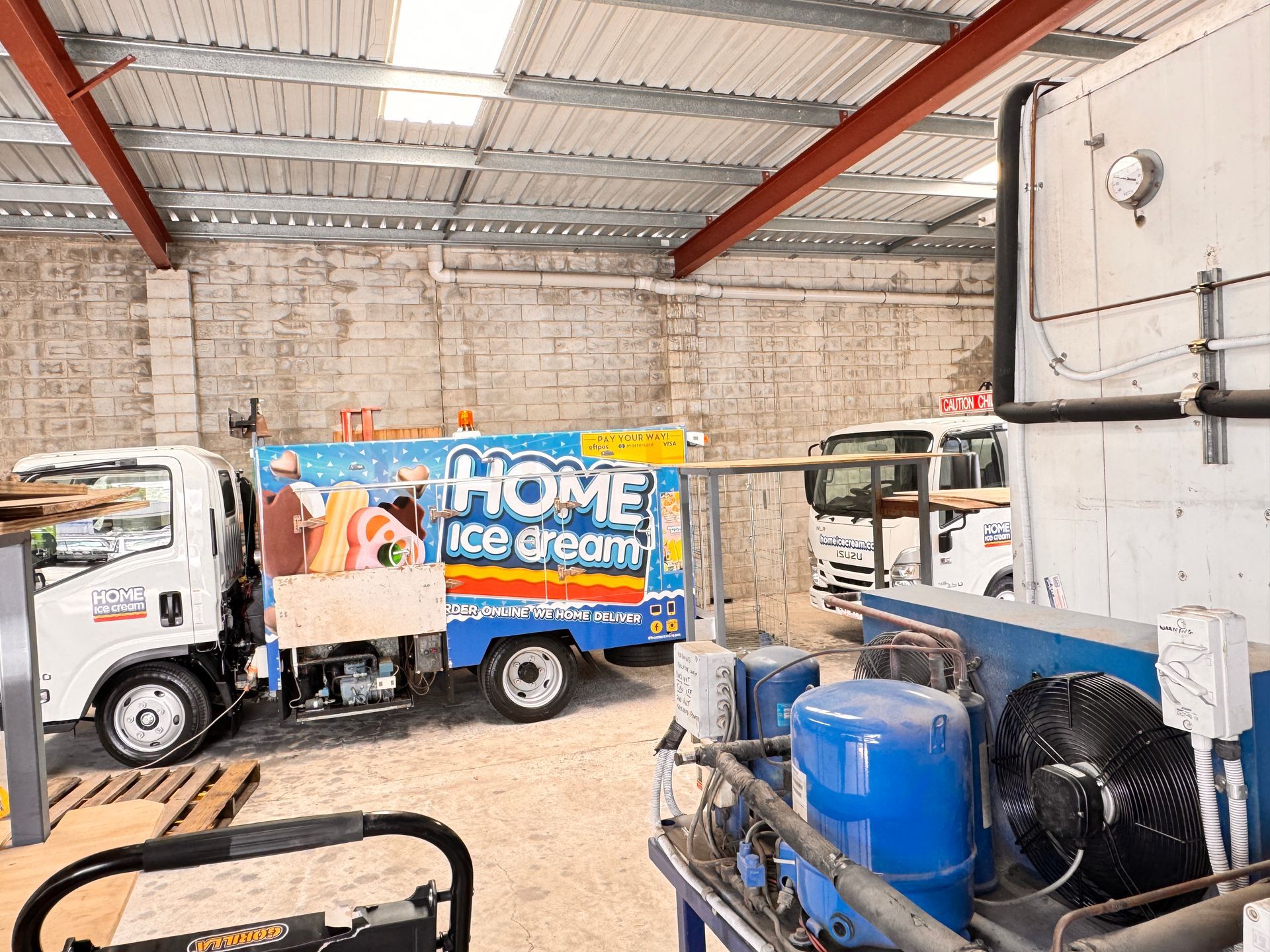 An Empty Refrigerator With Stainless Steel Shelves — Chillzone Refrigeration and Air Conditioning in Montville, QLD