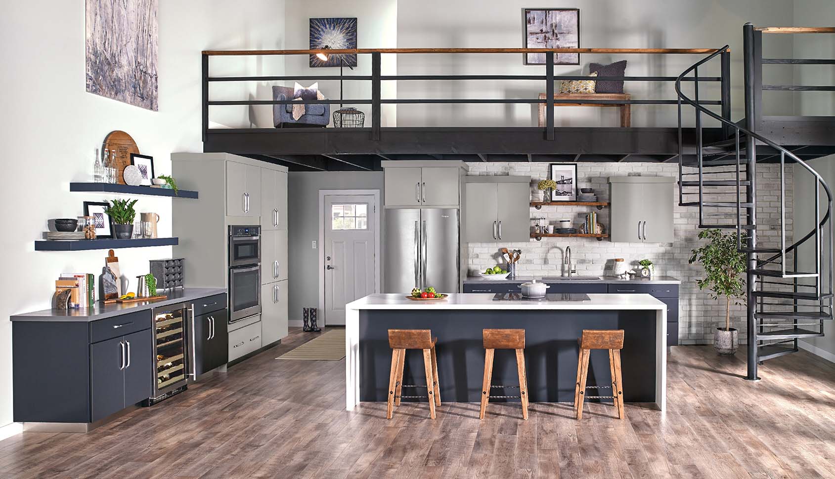 Modern kitchen with a loft area, stainless steel appliances, and blue island.