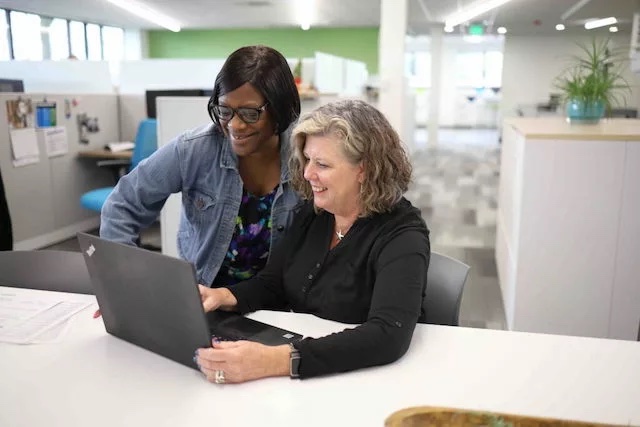 Women looking at post it notes