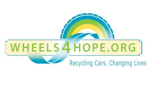 Wheels4Hope logo with a tire arch, green, blue, and yellow elements, text