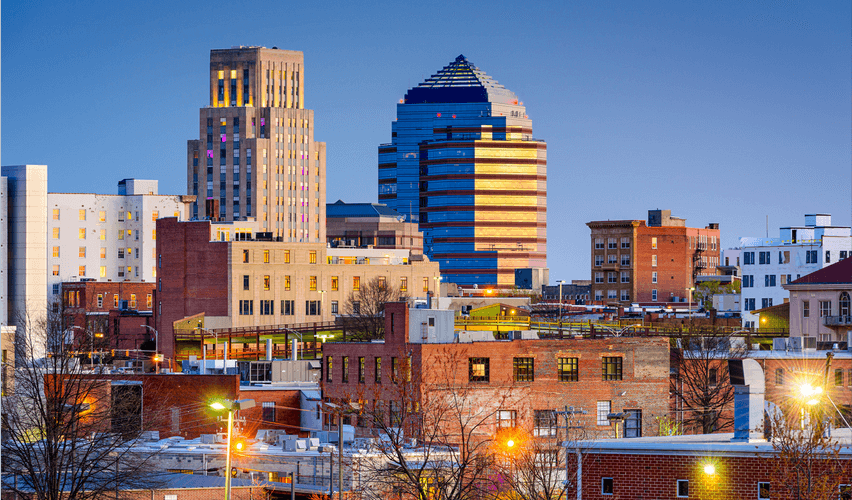 A city skyline with a tall building in the middle