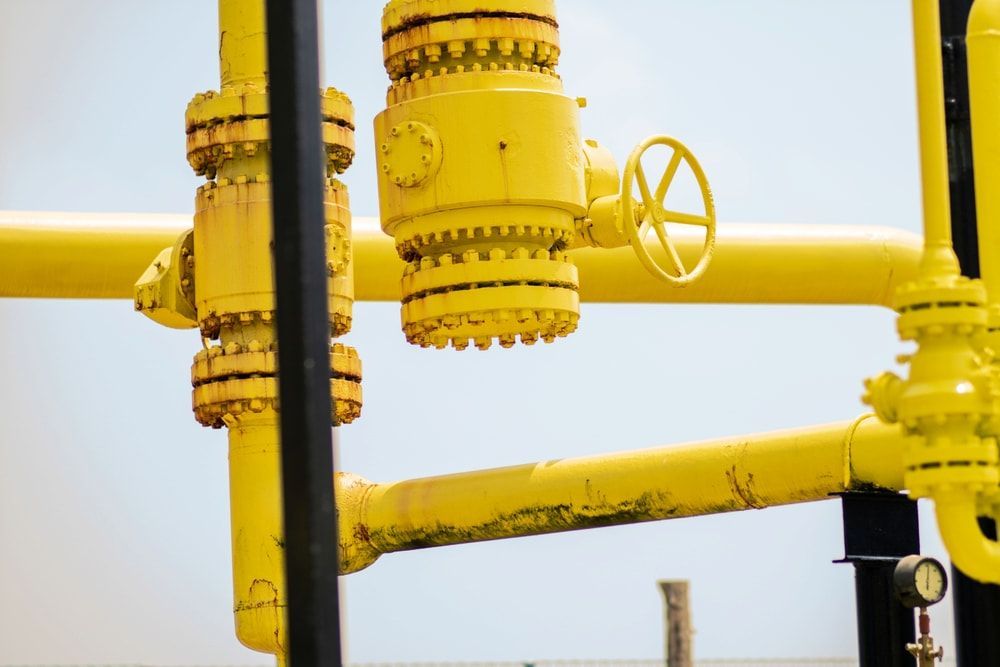 A Close Up Of A Yellow Pipe With A Valve On It — Chad Taylor Plumbing In Forster, NSW