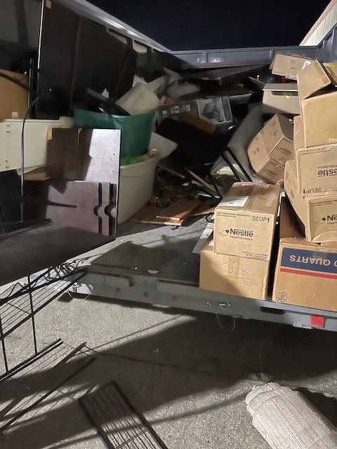 A bunch of cardboard boxes are stacked on top of each other