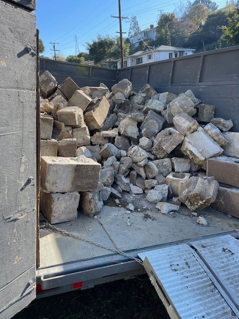 A pile of rocks in the back of a truck