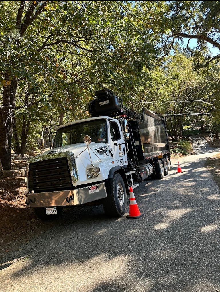 A white truck is parked on the side of a road.