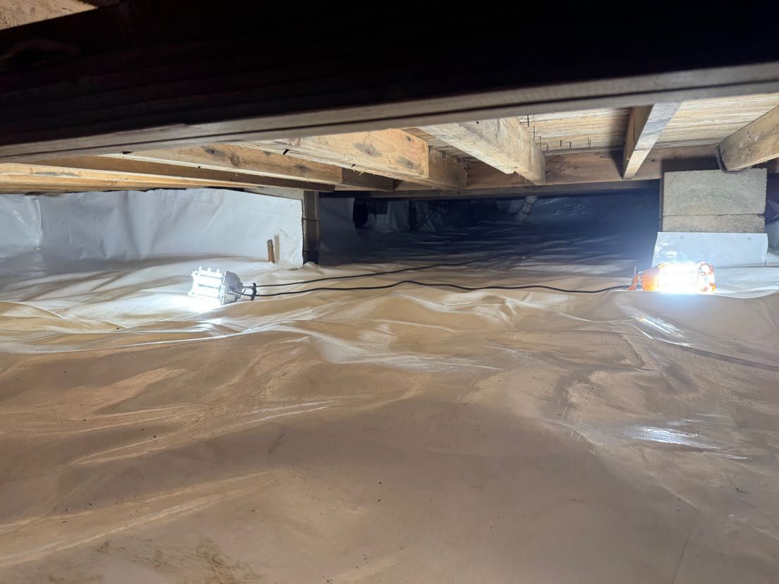 A picture of a crawl space under a house.