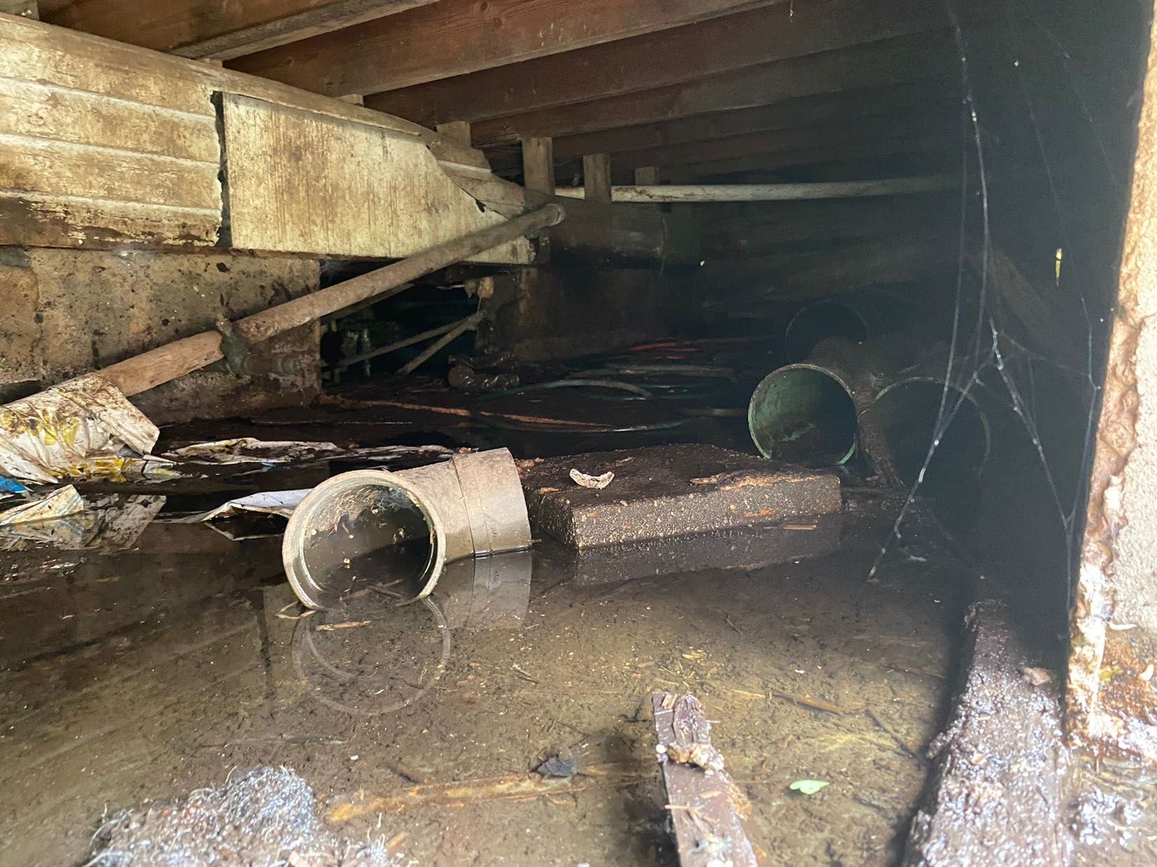There is a lot of water in the basement of a house.