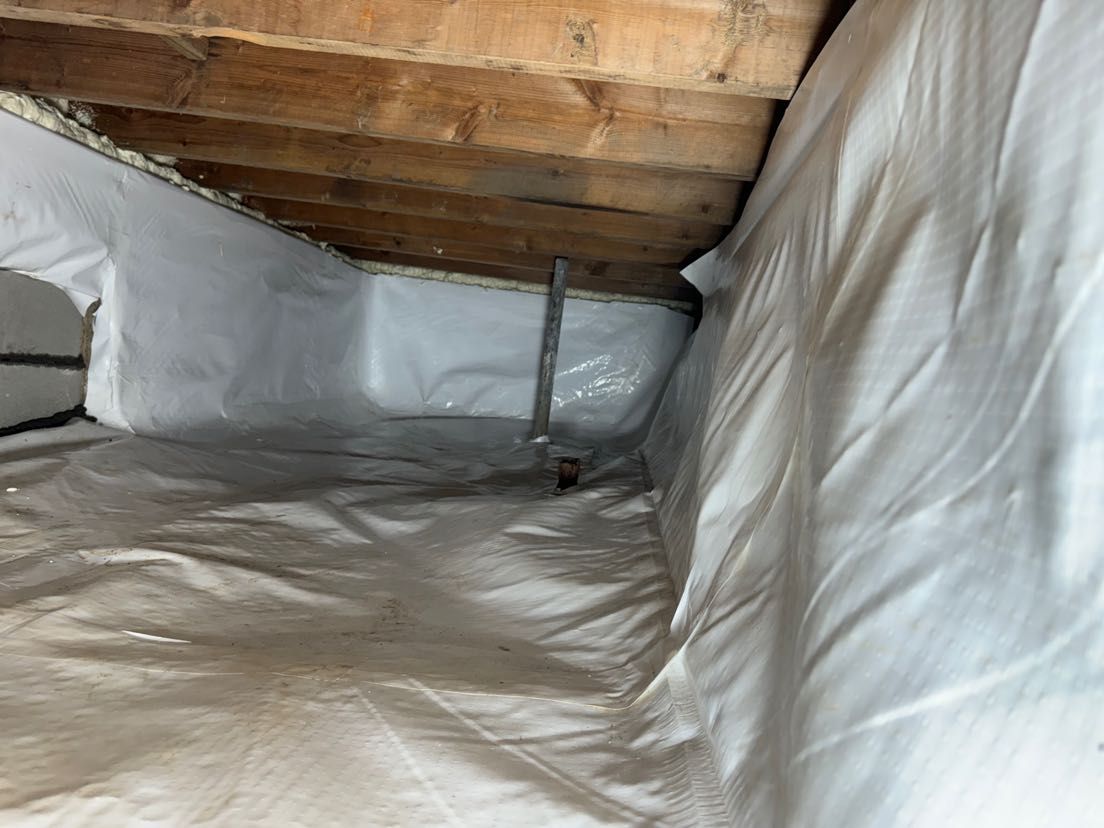A room with a lot of white sheets on the floor.