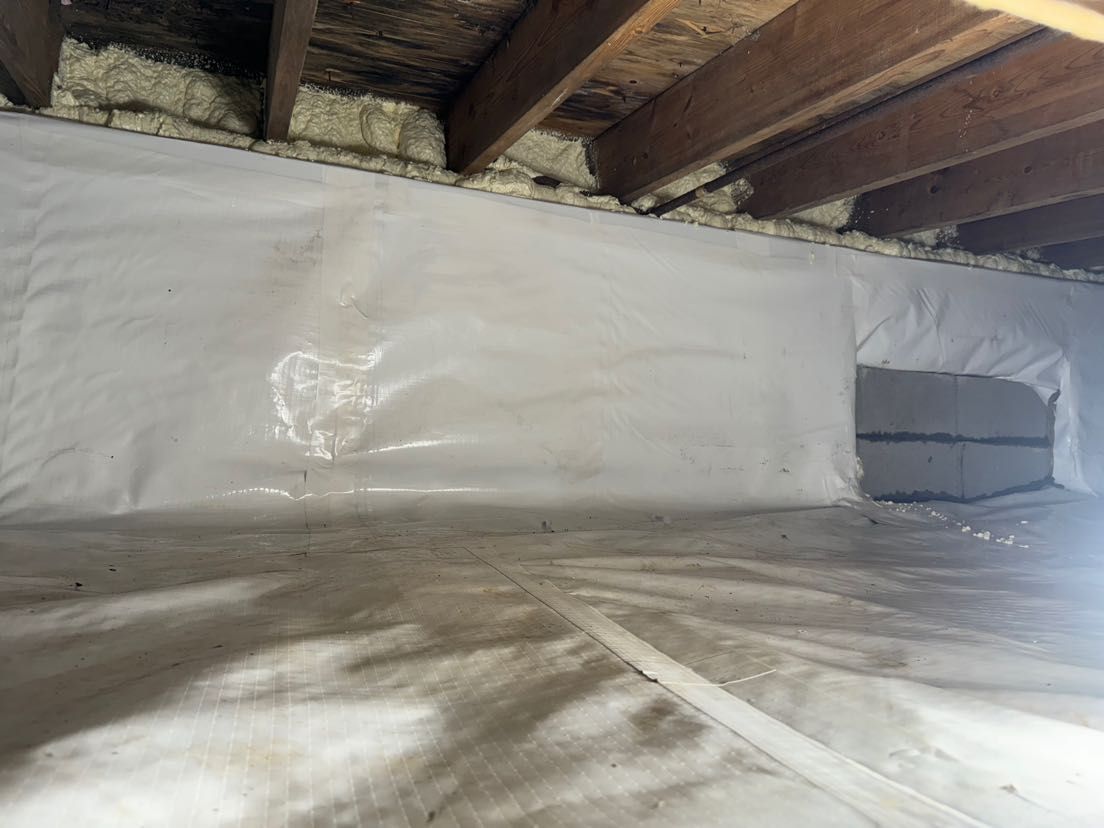 There is a hole in the ceiling of the basement.