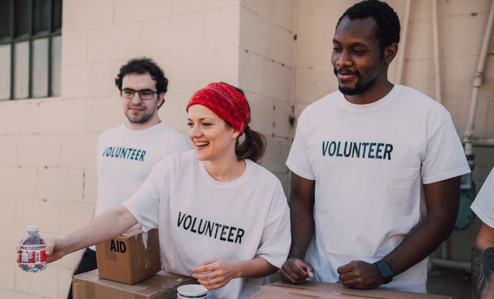 Volunteers hand out water
