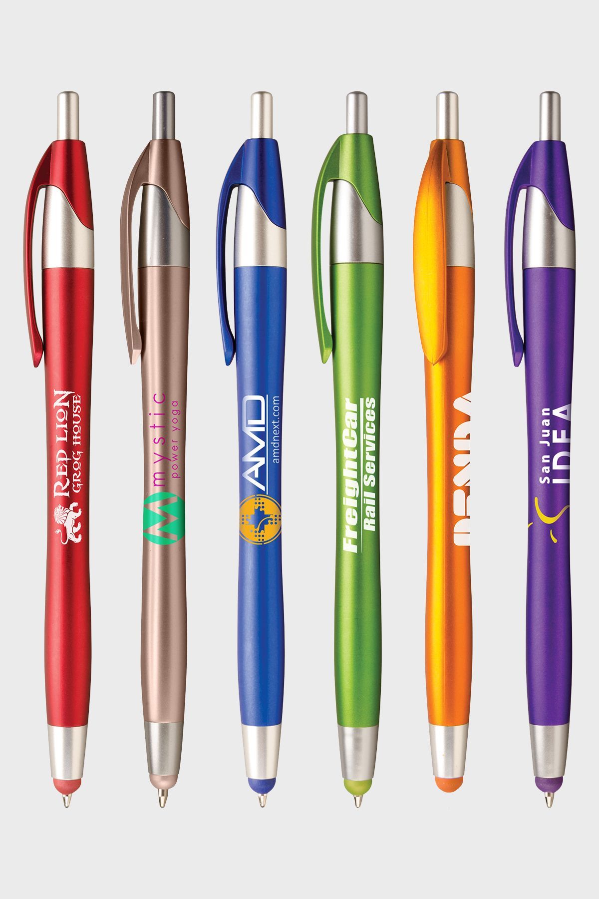 Six colorful click-action ballpoint pens with integrated stylus tips, standing in a row against a light grey background.