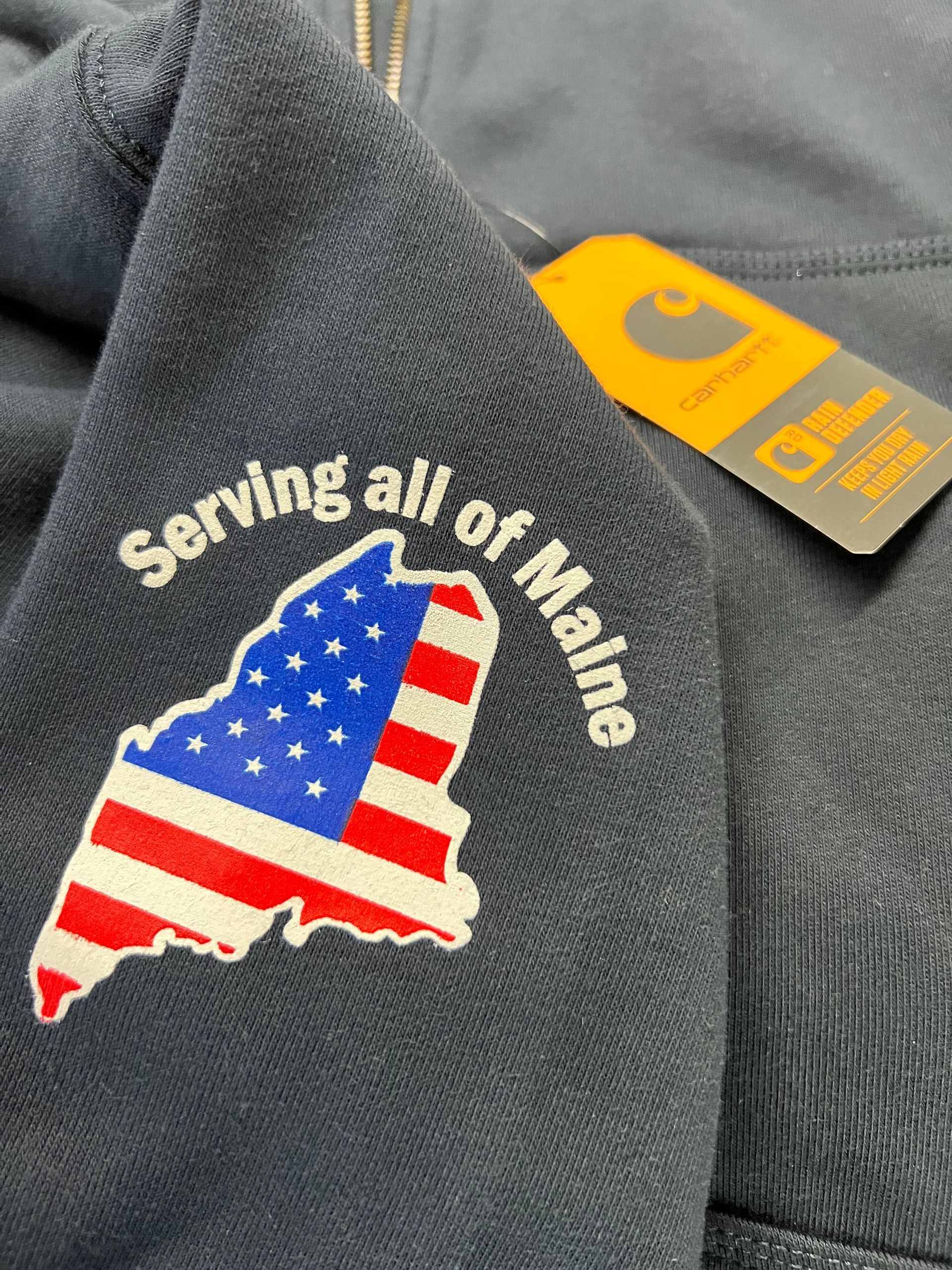 Carhartt sweatshirt with a custom silk screened Maine outline flag patch and 