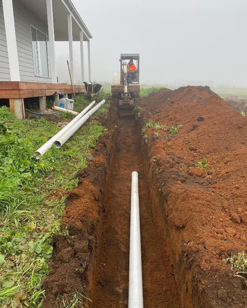 White Pipe Is Being Installed In The Trench In Front Of A House — ASAP Local Plumbing in Warrnambool, VIC