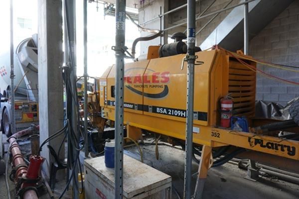 A yellow machine with the word sales on it