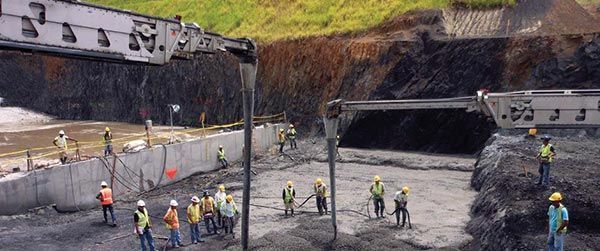 A group of construction workers are working on a construction site.