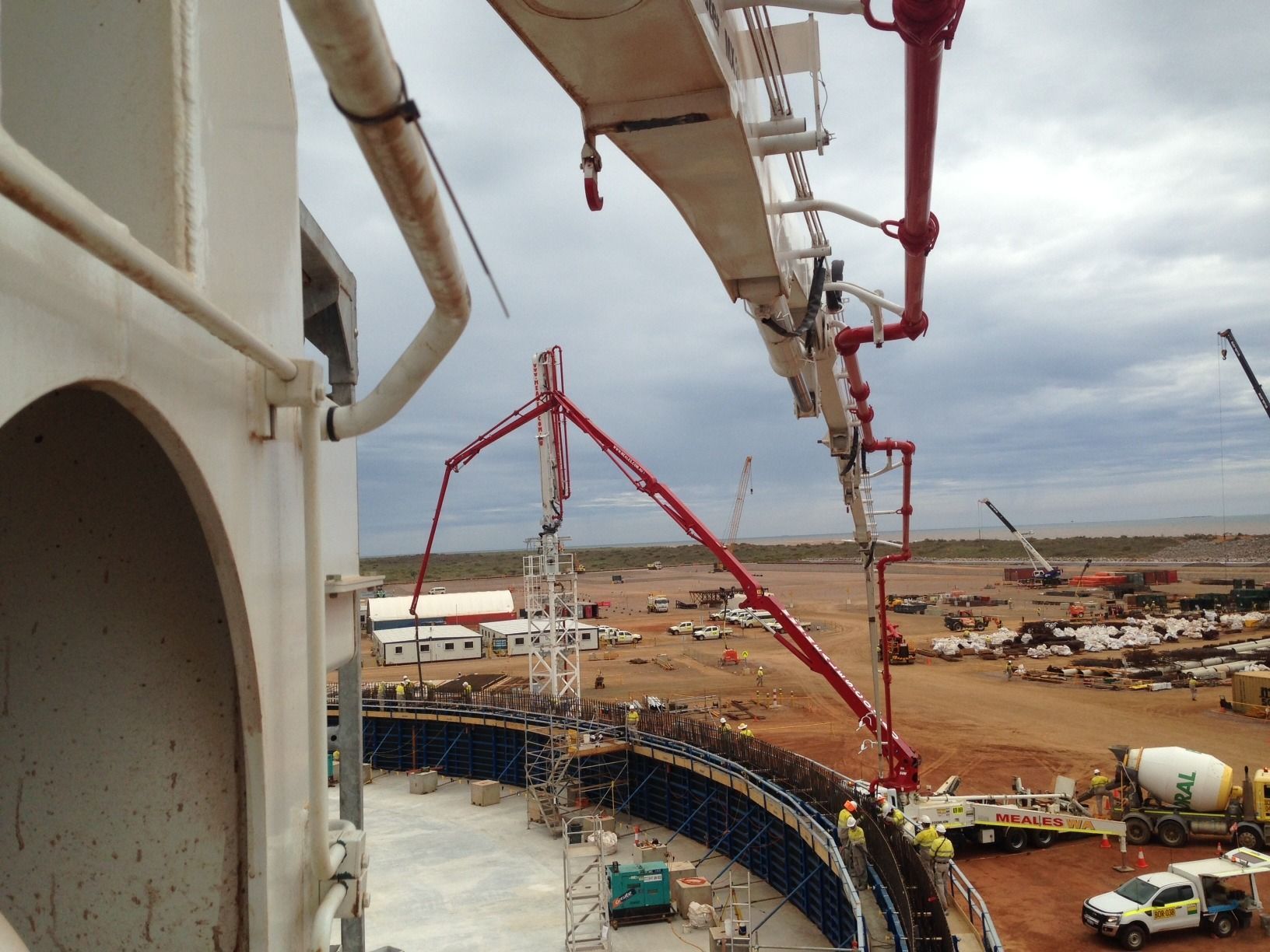 A large concrete pump is being used on a construction site