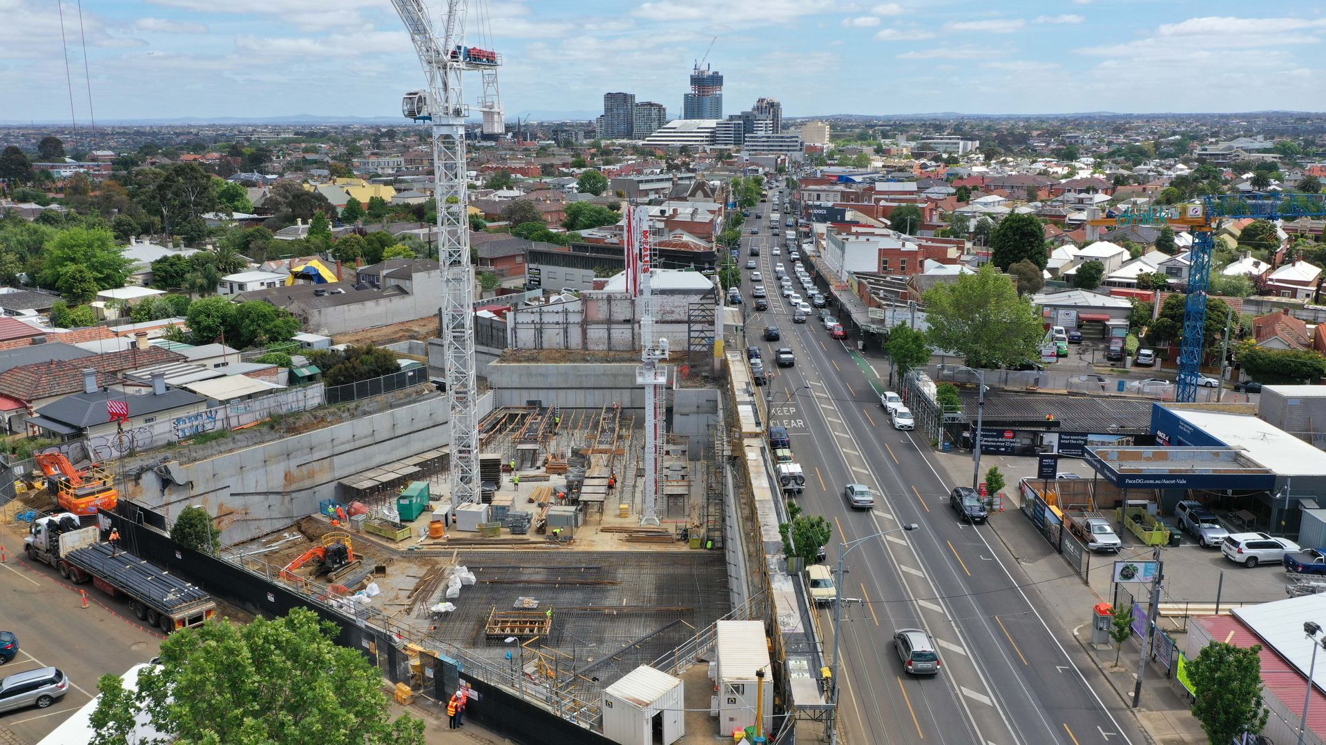 An aerial view of a construction site in the middle of a city.