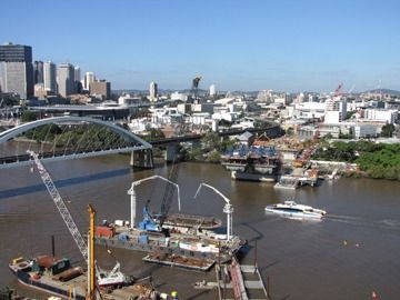An aerial view of a bridge over a river in a city