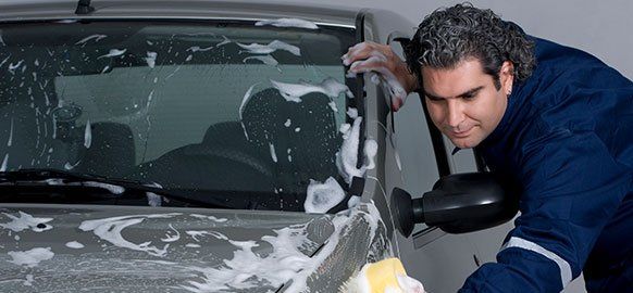 Worker Washing the Car — Erie, PA — Sparkle Clean Car Care
