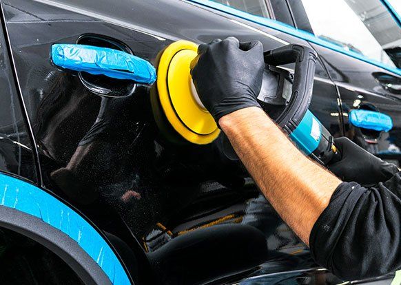 Worker Polishing the Car — Erie, PA — Sparkle Clean Car Care