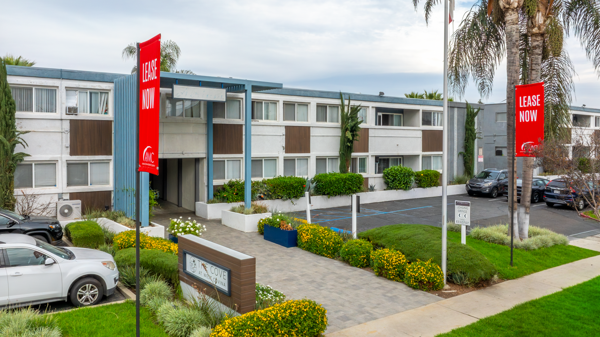 front of apartment building with flag