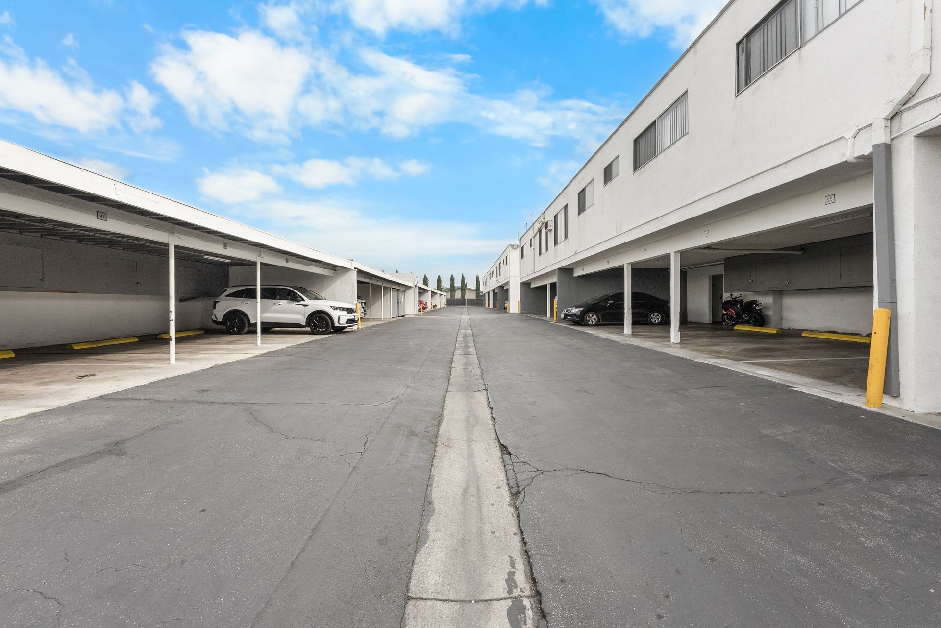 parking lot with carports and garages