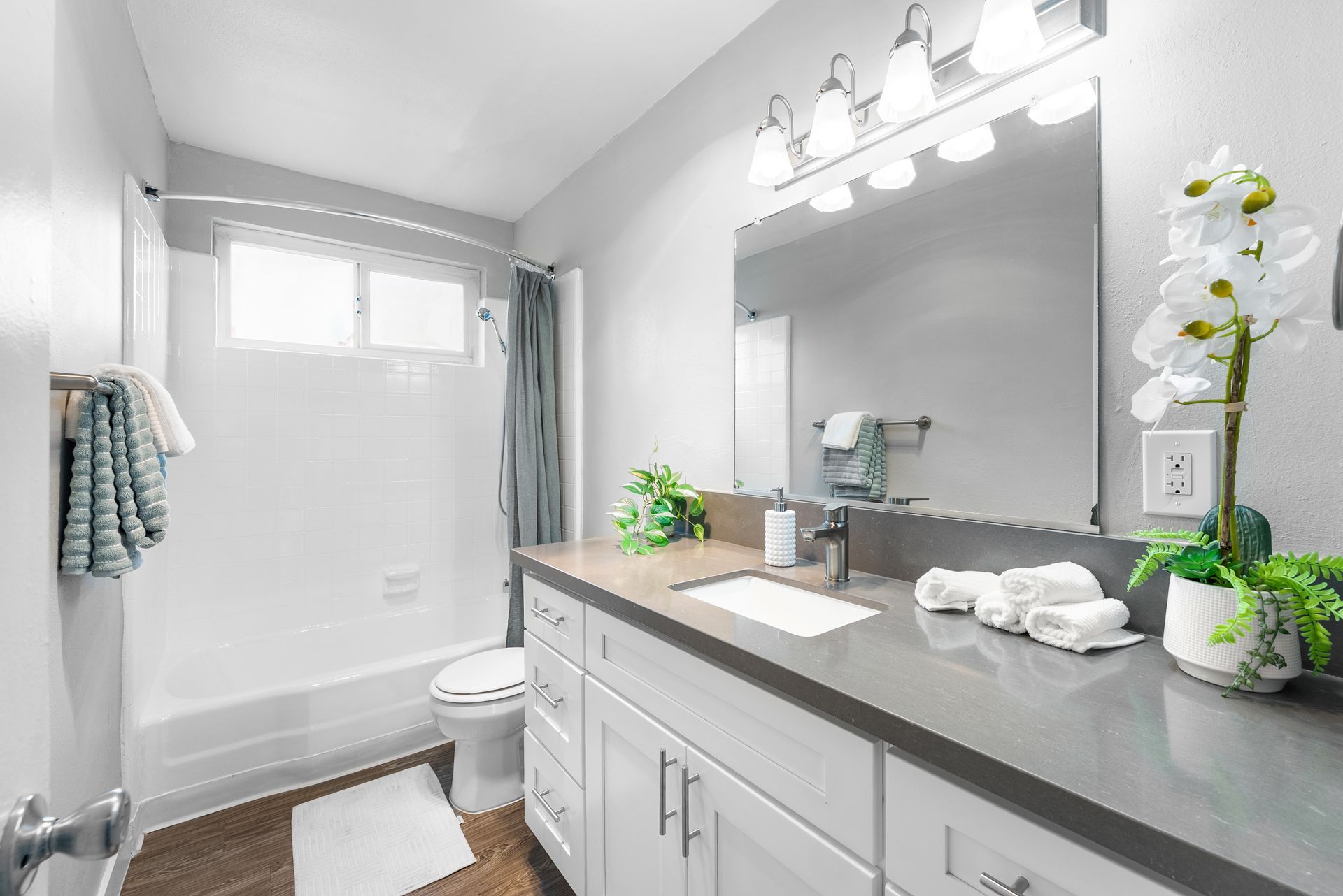 restroom with sink, toilet, and shower