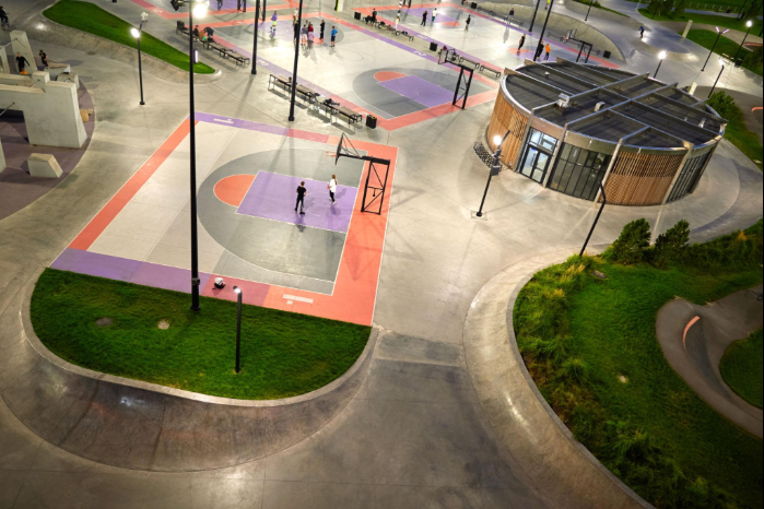 “Aerial view of a colorful outdoor basketball court in a landscaped park during a court builder service in Henderson, NV”