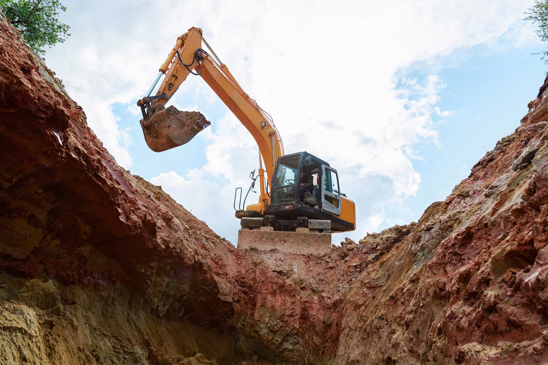 Excavator completing site work