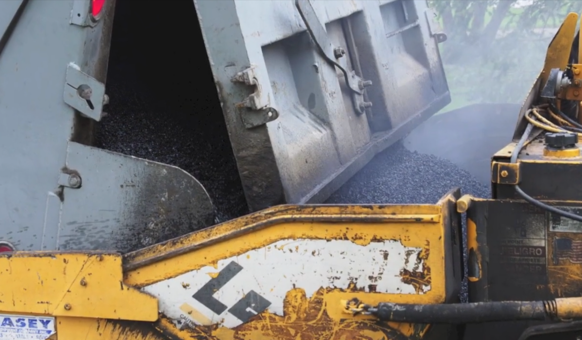 Truck loading paver