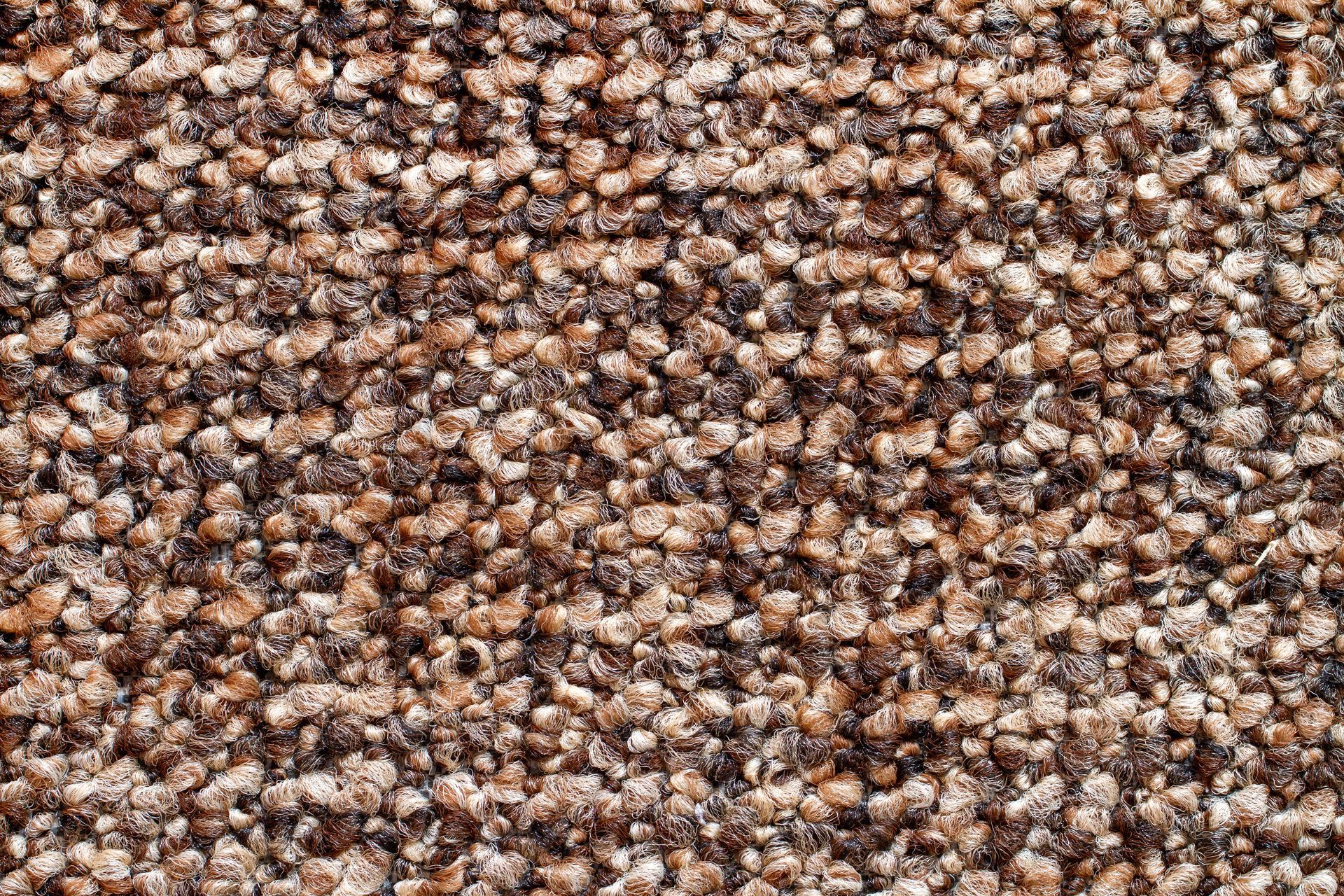 Close-up of a brown and beige pebbled or textured surface pattern