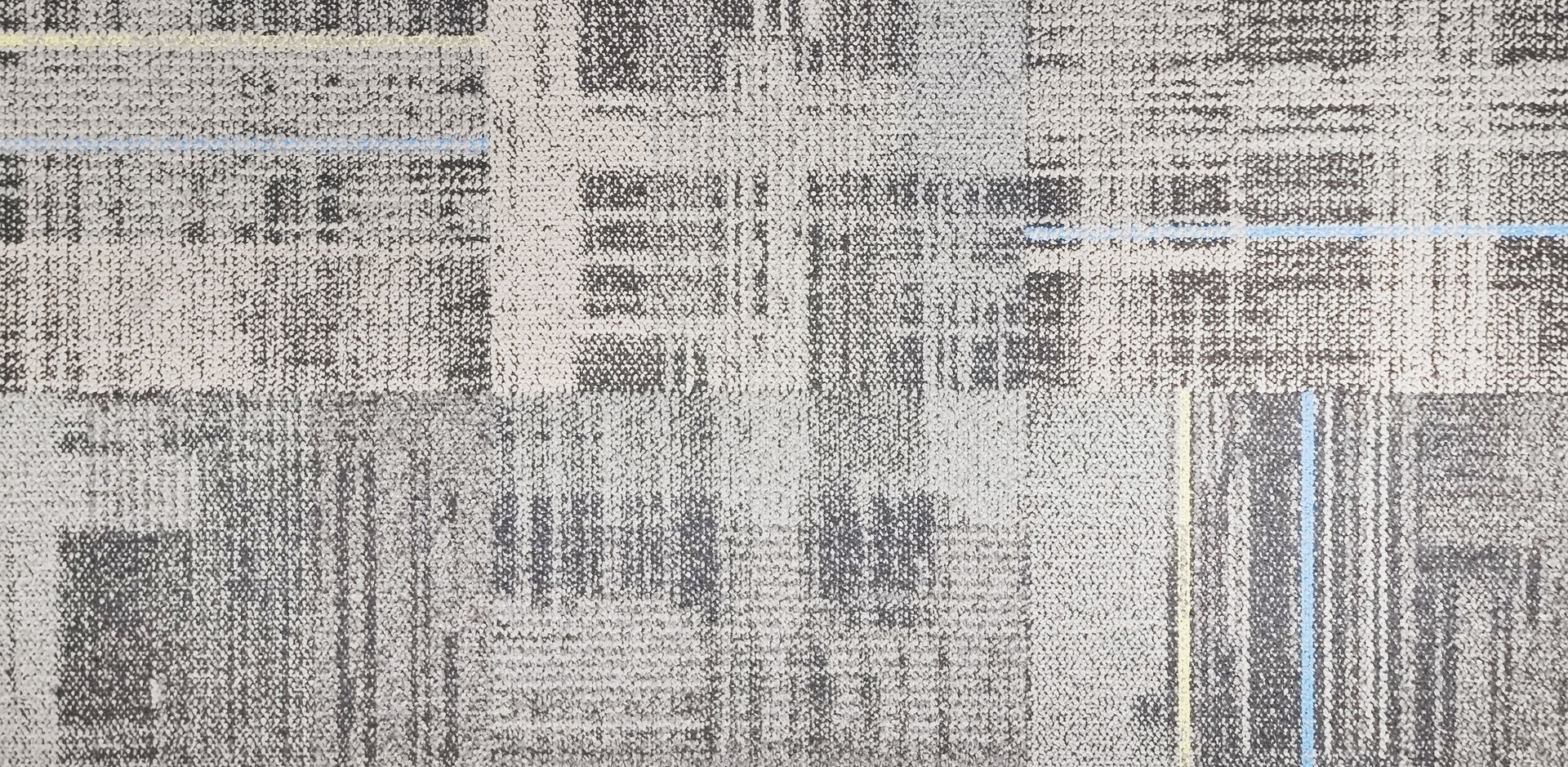 Abstract gray and beige textured pattern with vertical and horizontal lines, resembling a distorted cityscape or fabric weave