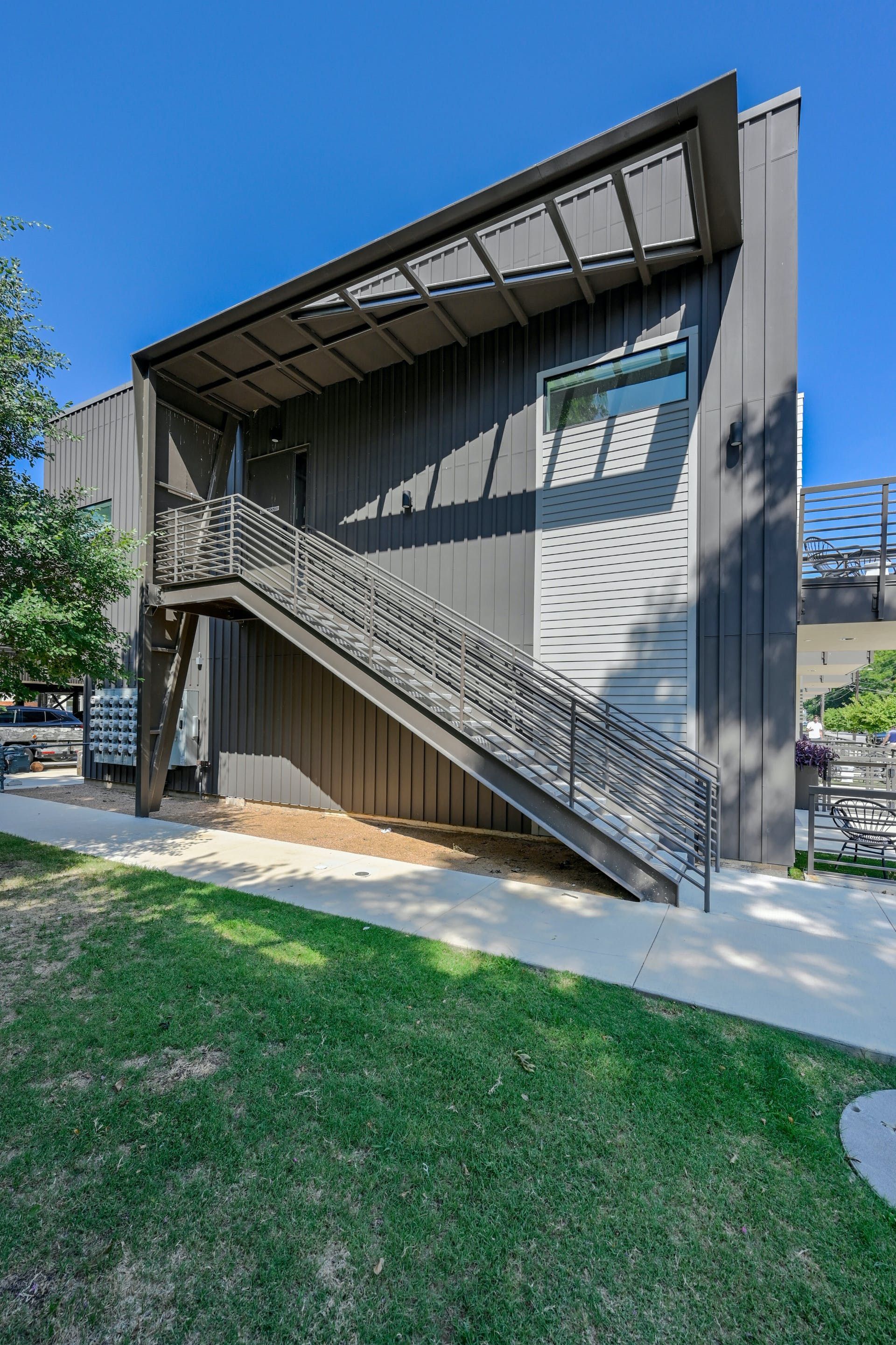 A building with stairs leading up to the second floor.