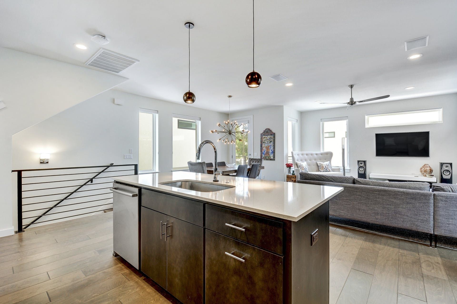 A kitchen with a large island and a sink