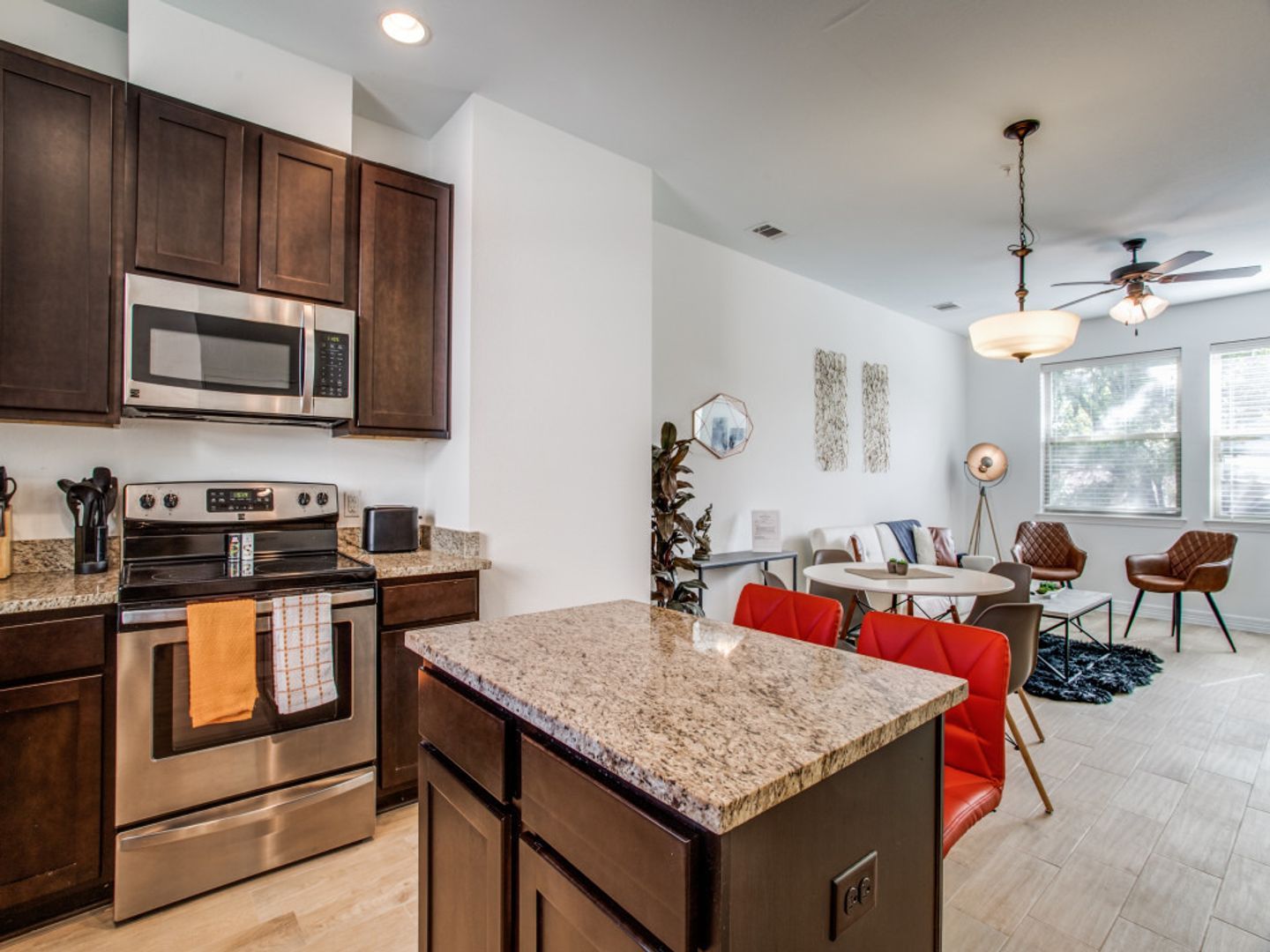 A kitchen with stainless steel appliances and granite counter tops