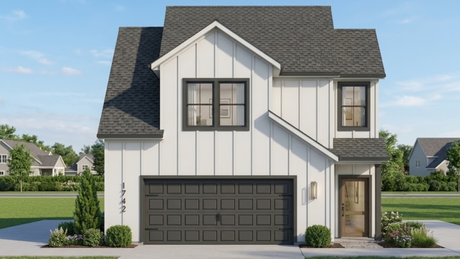Modern two-story white house with dark gray roof, black garage door, and small front entry