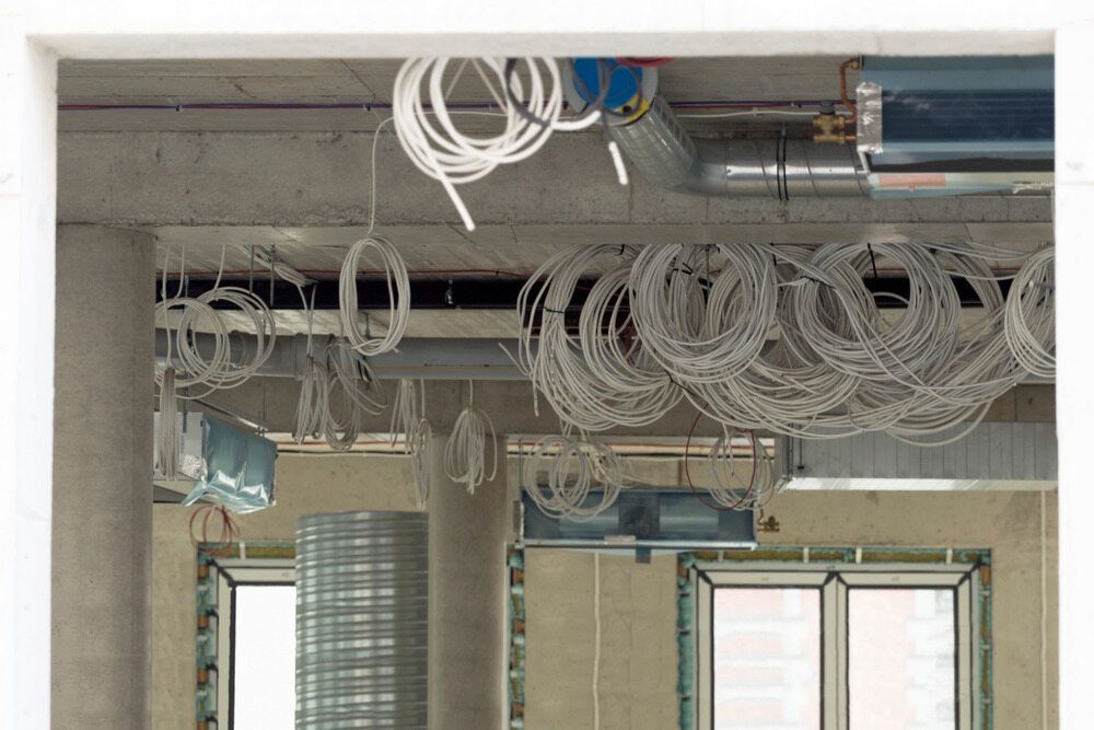 A Room With A Lot Of Wires Hanging From The Ceiling — Tony Andress Electrical In Montville, QLD