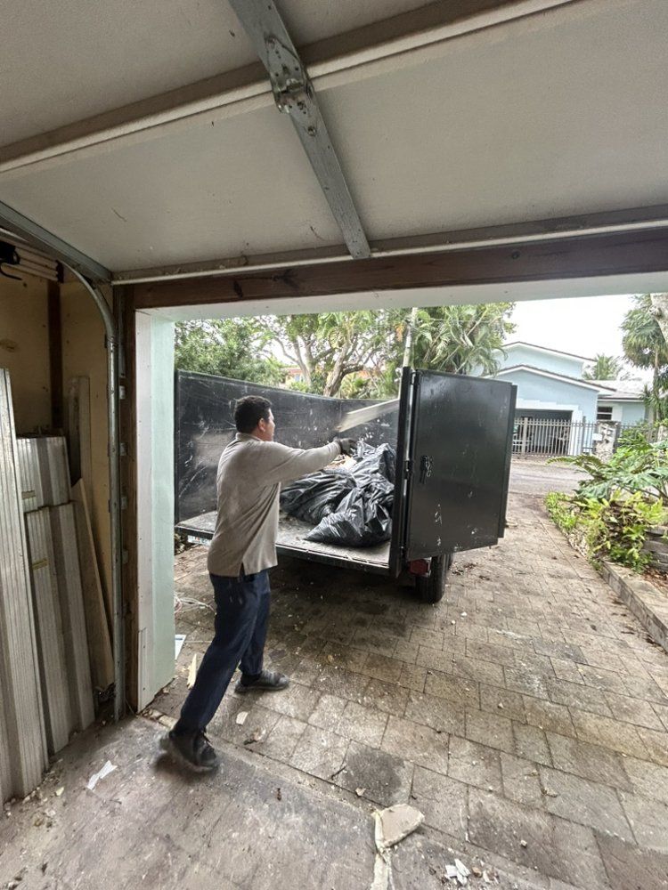 A man is loading boxes into a white van