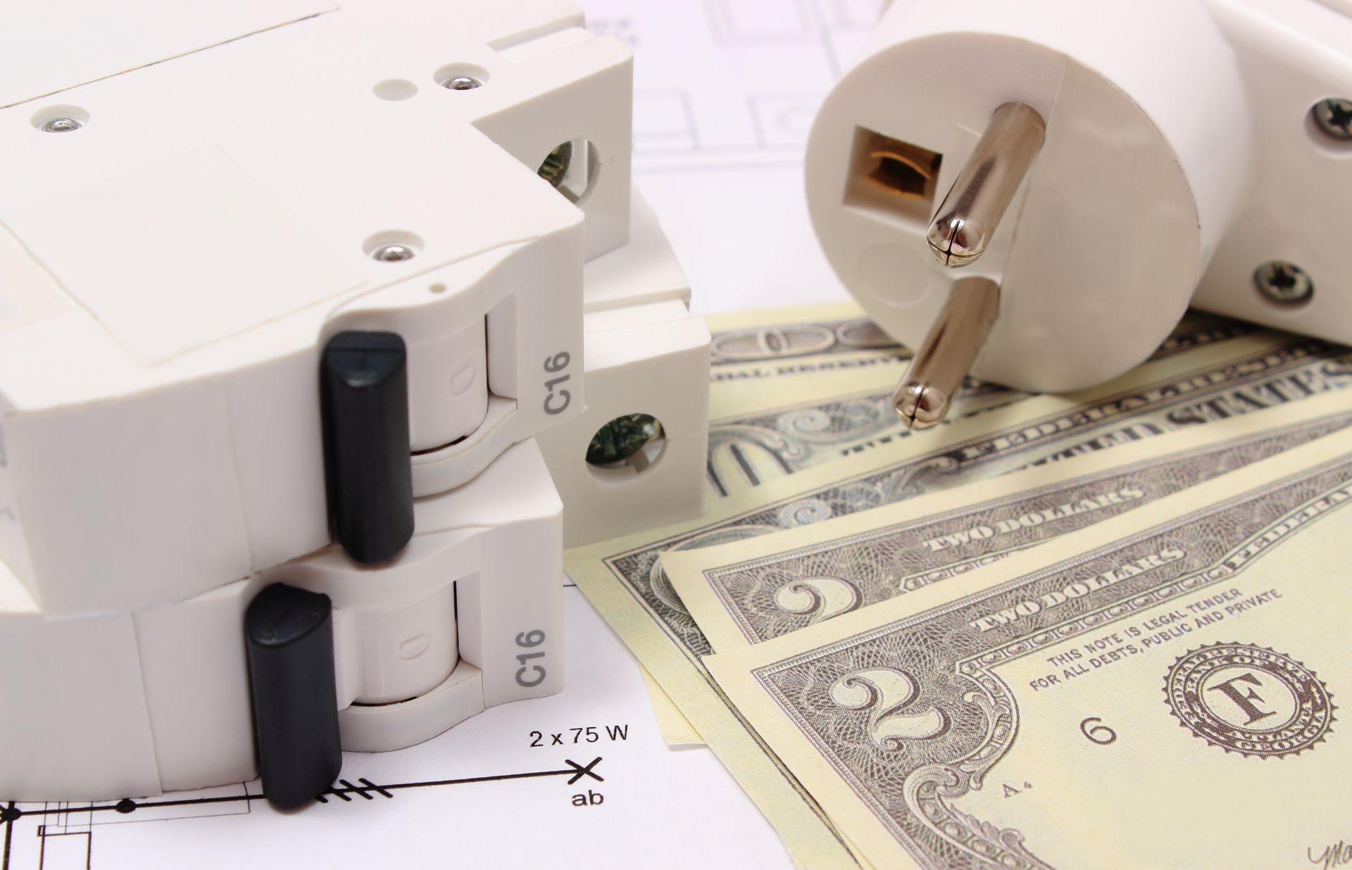 Electrical plug and outlet with U.S. dollar bills on a chart, symbolizing energy costs