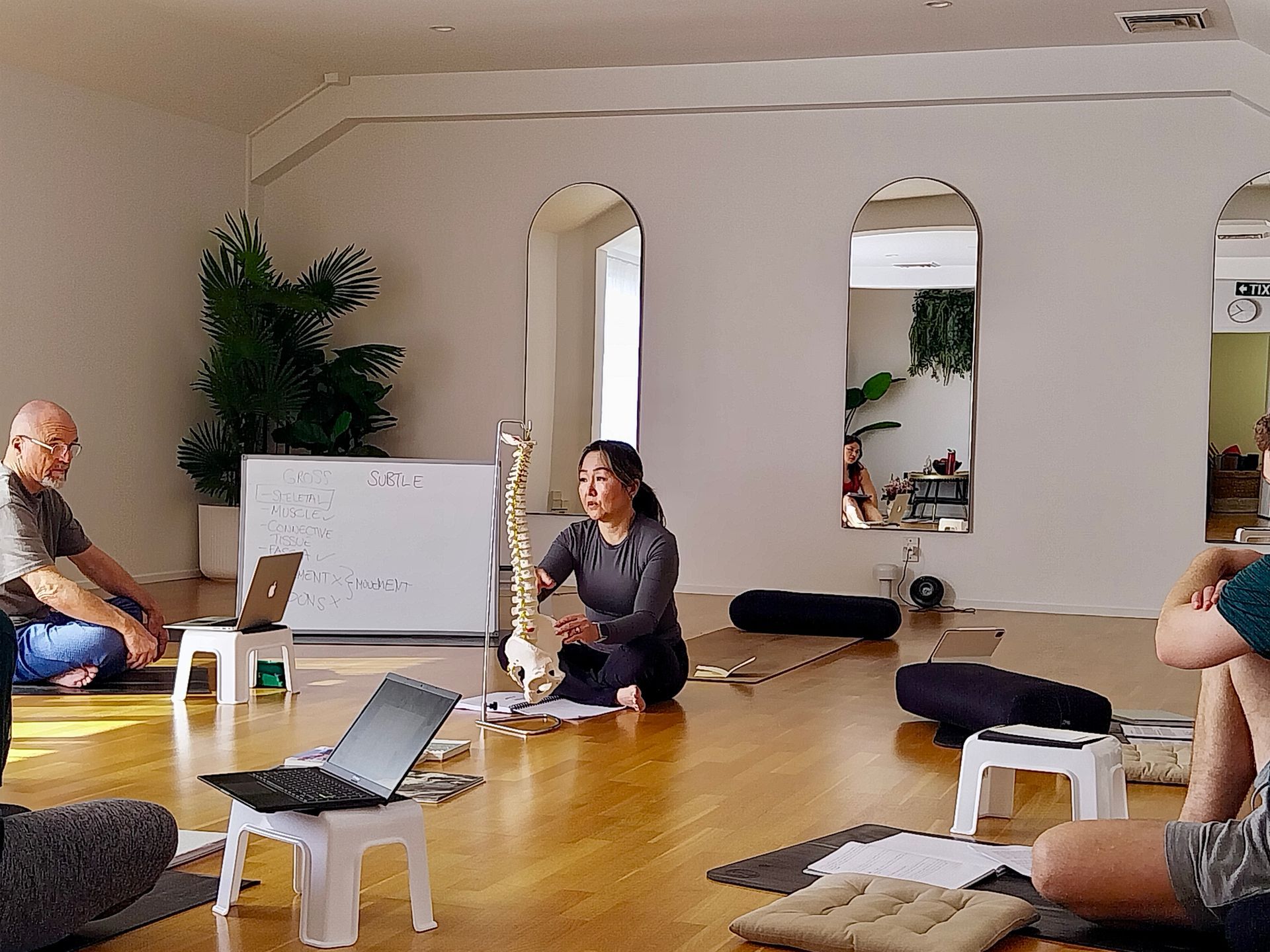 Yoga Teacher Training with a trainer explaining anatomy