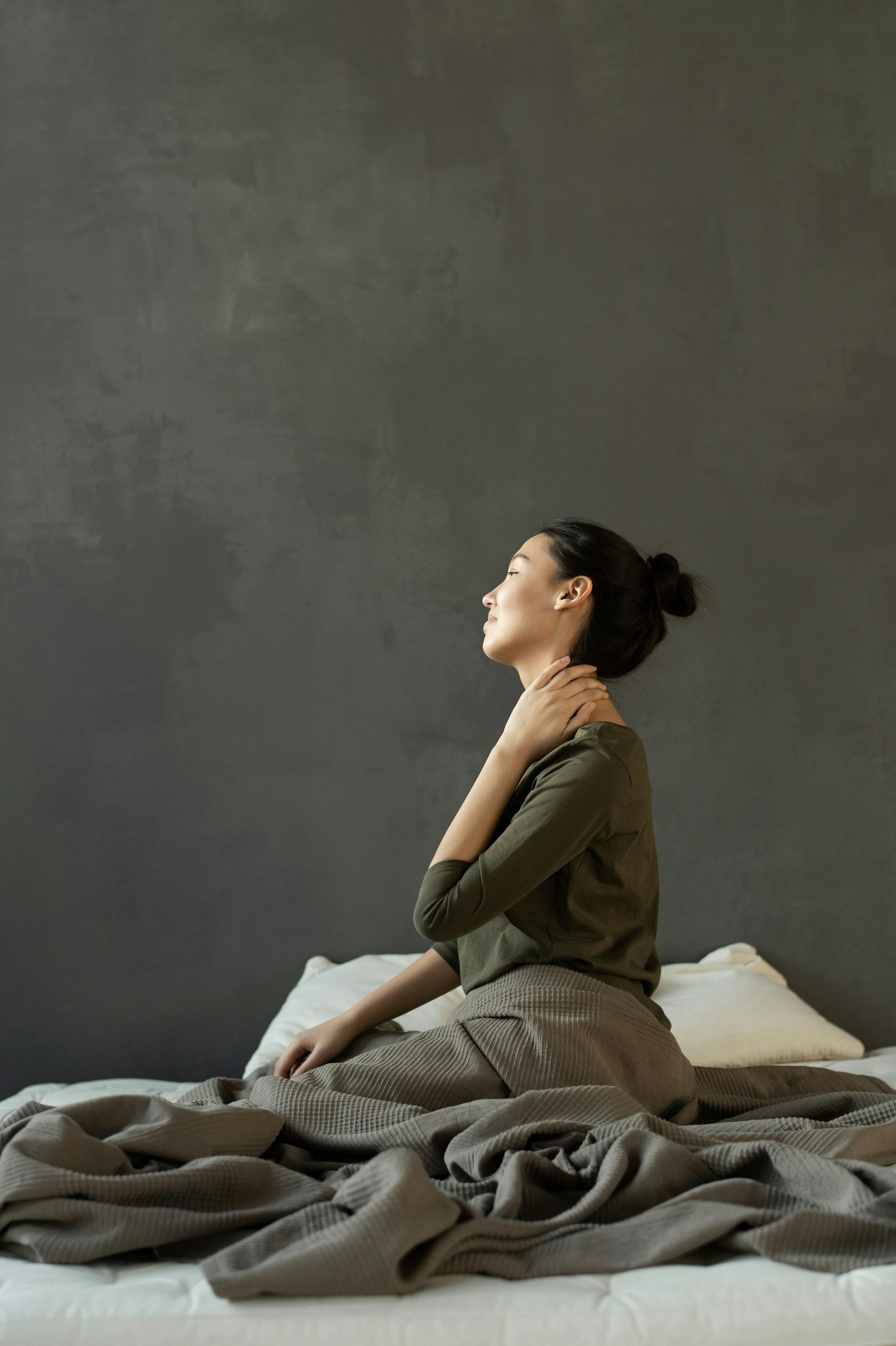 young woman feeling neck strain