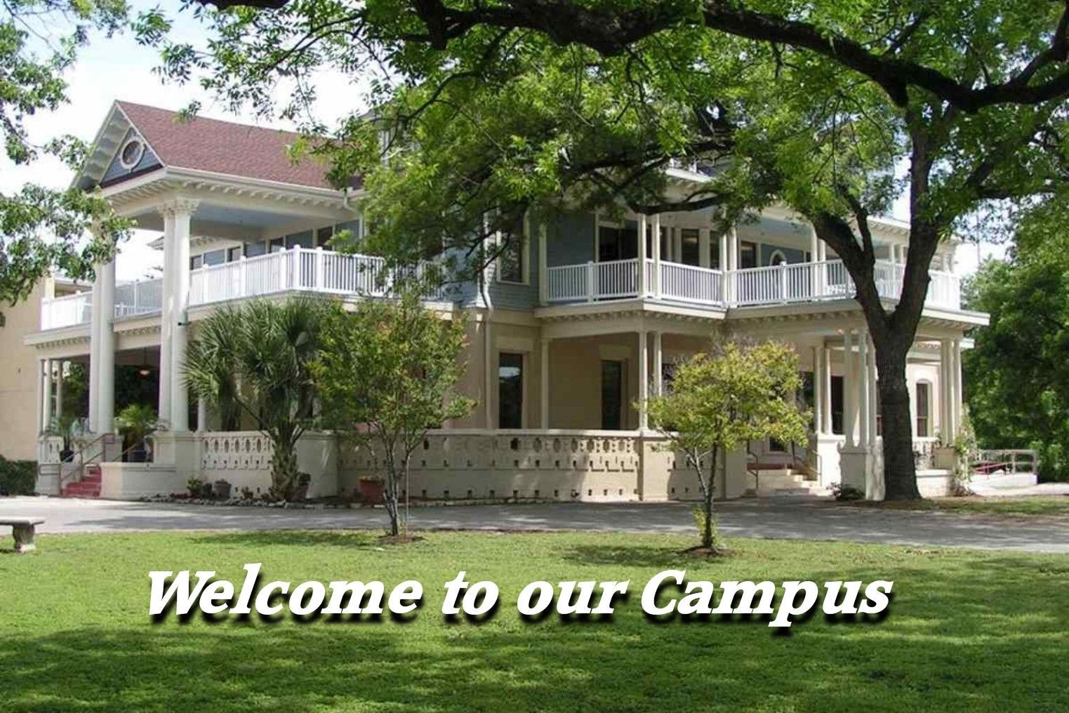 A large house with the words welcome to our campus below it
