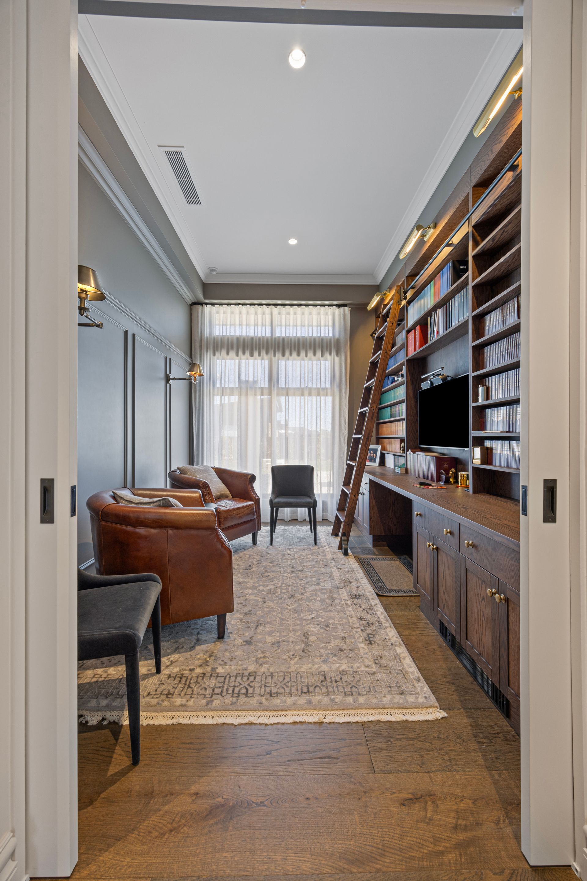 Warm-toned reading nook with natural light and bookshelves
