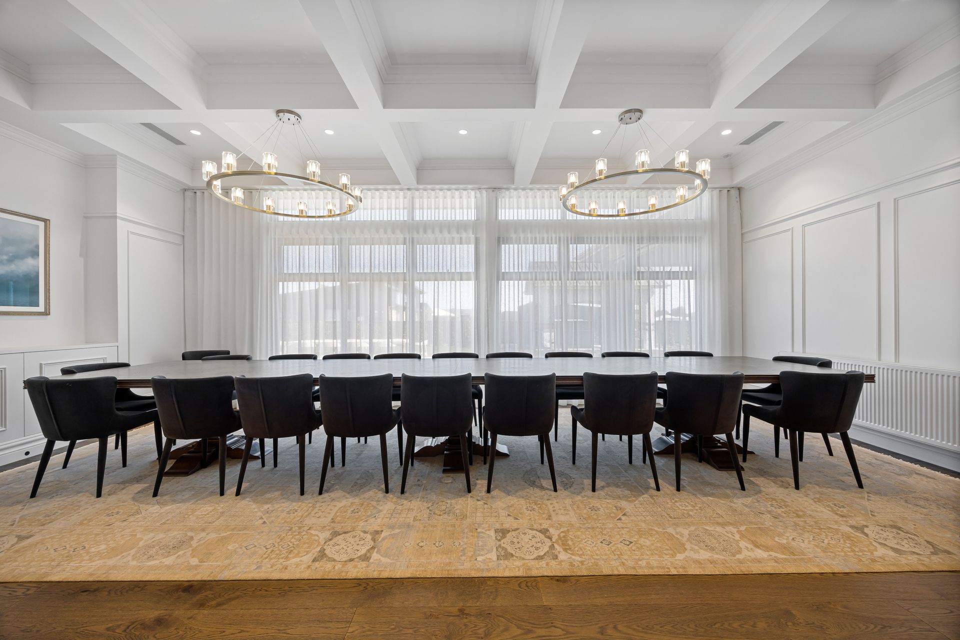Formal dining space with pendant lights and natural timber table